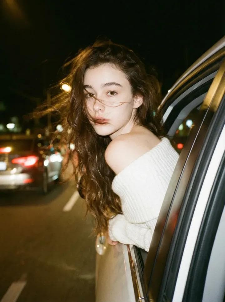 Wearing an off-the-shoulder white knitted top